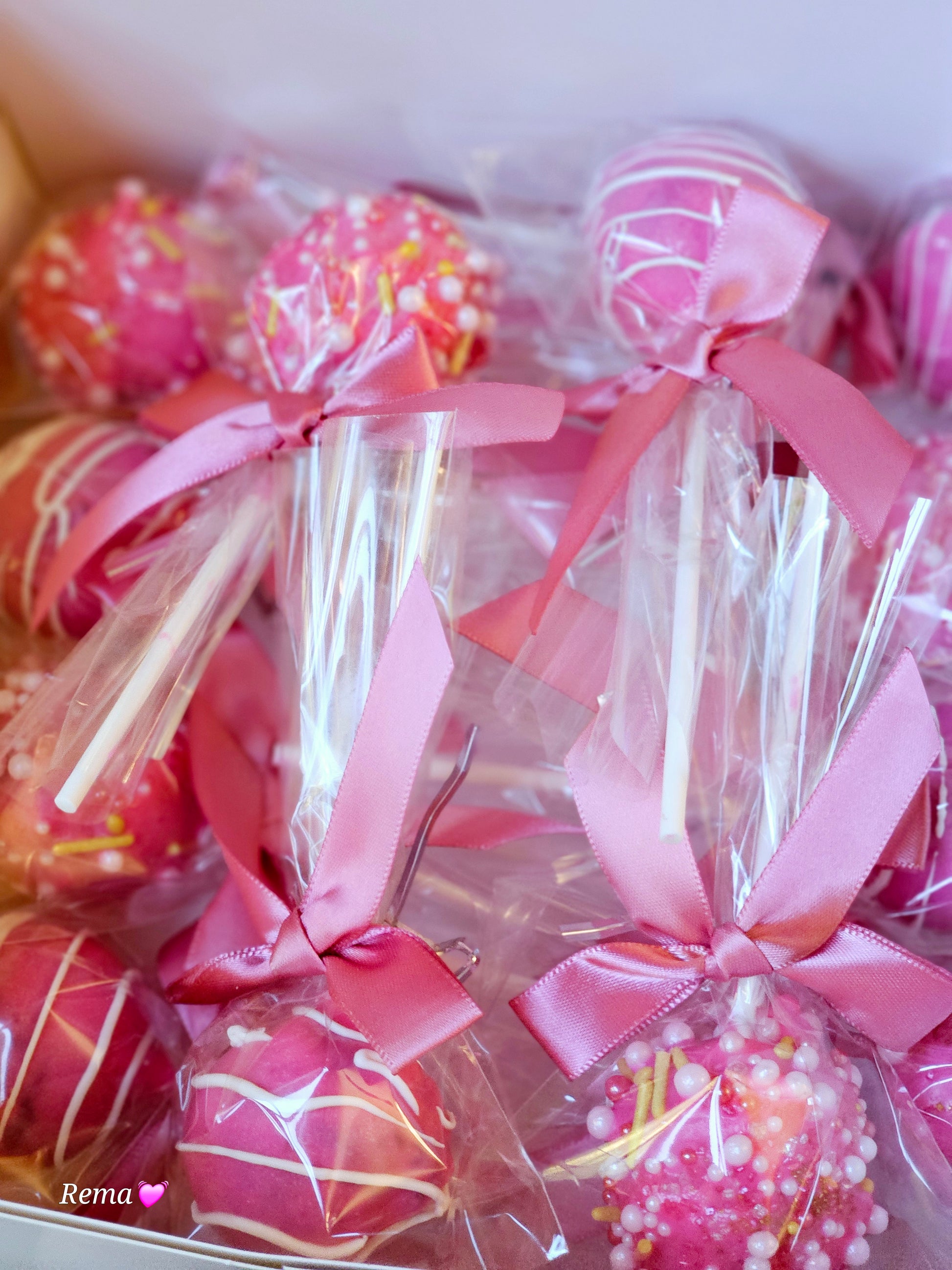 Assorted gourmet cakepops by Cakeit Fresh, dipped in colorful chocolate and topped with sprinkles.